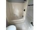 This bathroom features a combined tub and shower in a neutral shade, with basic fixtures at 3825 Old Coach Rd, Raleigh, NC 27616