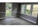 Cozy bedroom with fresh paint, new floor, and large windows at 3825 Old Coach Rd, Raleigh, NC 27616
