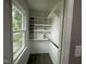 Walk-in closet featuring built-in shelving for efficient storage at 3825 Old Coach Rd, Raleigh, NC 27616