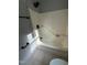 Bathtub with shower features a shower head, safety rail, and faucet at 3825 Old Coach Rd, Raleigh, NC 27616