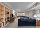 Finished basement with ample storage, including built-in shelves, and comfortable seating at 3919 Wentworth Dr, Durham, NC 27707