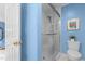 Clean bathroom featuring a glass-enclosed shower and tiled walls at 3919 Wentworth Dr, Durham, NC 27707