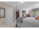 Bright bedroom with a four-poster bed, closet doors, and lots of storage at 3919 Wentworth Dr, Durham, NC 27707