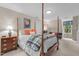 Spacious bedroom with a four-poster bed and a cozy seating area at 3919 Wentworth Dr, Durham, NC 27707
