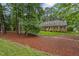 Traditional two-story home with a well-manicured lawn, mature trees, and a welcoming front entrance at 3919 Wentworth Dr, Durham, NC 27707