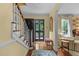 Inviting foyer features hardwood floors, staircase, and bright natural light at 3919 Wentworth Dr, Durham, NC 27707