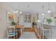 Open kitchen with a breakfast bar and hardwood floors at 3919 Wentworth Dr, Durham, NC 27707