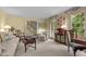 Comfortable living room with large windows and traditional furnishings at 3919 Wentworth Dr, Durham, NC 27707