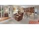 Comfortable living room featuring a fireplace, built-in bookshelves, and stylish furniture at 3919 Wentworth Dr, Durham, NC 27707