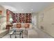 Cozy living room with a built-in bookcase, comfortable seating, and ample lighting at 3919 Wentworth Dr, Durham, NC 27707