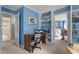 Comfortable office space with a desk, bookshelves, and adjacent bedroom view at 3919 Wentworth Dr, Durham, NC 27707