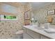 Charming powder room featuring floral wallpaper and a window view at 3919 Wentworth Dr, Durham, NC 27707