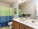 Bathroom with double sinks and decorative shower curtain at 4234 Offshore Dr, Raleigh, NC 27610