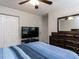 Primary bedroom with ceiling fan and dresser at 4234 Offshore Dr, Raleigh, NC 27610