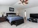 Spacious bedroom with neutral carpet, lots of natural light, and a tray ceiling at 4234 Offshore Dr, Raleigh, NC 27610