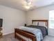 Bedroom with ceiling fan, carpeted floor, and natural light at 4234 Offshore Dr, Raleigh, NC 27610