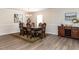 Elegant dining room with a wooden table, decorative rug, and ample space for Gathering gatherings at 4234 Offshore Dr, Raleigh, NC 27610