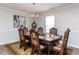 Formal dining area with a large wooden table, patterned chairs, and a chandelier, ideal for entertaining guests at 4234 Offshore Dr, Raleigh, NC 27610