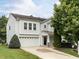 Charming two-story home with a well-maintained front yard, attached garage, and a welcoming entrance at 4234 Offshore Dr, Raleigh, NC 27610