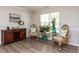 Cozy living room featuring hardwood floors, natural light, and stylish decor, perfect for relaxation at 4234 Offshore Dr, Raleigh, NC 27610