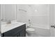 Well-lit bathroom featuring a vanity, toilet, and shower-tub combo, designed for comfort and functionality at 425 Edison Rail Ln, Knightdale, NC 27545