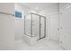 This bathroom showcases a tiled shower with a glass enclosure, providing a sleek and modern look at 425 Edison Rail Ln, Knightdale, NC 27545