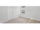 Cozy bedroom with neutral carpet, and a bright window at 425 Edison Rail Ln, Knightdale, NC 27545