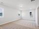 Bright bedroom with large windows and neutral carpet, a cozy and inviting space for relaxation at 425 Edison Rail Ln, Knightdale, NC 27545
