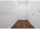 Walk-in closet with wire shelving and wood floor for ample storage and organization in your new home at 425 Edison Rail Ln, Knightdale, NC 27545