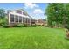 Expansive, well-maintained backyard, offering ample space for outdoor activities and featuring a screened-in porch at 498 Mountain Laurel, Chapel Hill, NC 27517