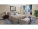 Cozy bedroom with neutral tones, plush bedding, and a window providing natural light at 498 Mountain Laurel, Chapel Hill, NC 27517