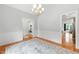 Bright dining room featuring hardwood floors, decorative rug, and modern trim at 498 Mountain Laurel, Chapel Hill, NC 27517