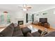 Comfortable living room featuring a fireplace, hardwood floors, and natural light at 498 Mountain Laurel, Chapel Hill, NC 27517