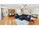 Open-concept living room with hardwood floors adjacent to kitchen with breakfast bar seating at 498 Mountain Laurel, Chapel Hill, NC 27517