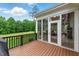Inviting sunroom with access to a spacious deck, perfect for enjoying views of the golf course and backyard at 498 Mountain Laurel, Chapel Hill, NC 27517