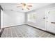 Bright living room featuring a decorative floor, ample natural light from a large window, and neutral wall colors at 504 Delaware Ave, Burlington, NC 27217