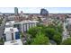 Cityscape aerial view with modern residential and commercial buildings, plus lush mature green tree canopy at 515 N Mangum St # 41, Durham, NC 27701