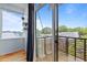 Balcony view, showing the wood railing and partial view of neighborhood at 515 N Mangum St # 41, Durham, NC 27701