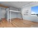 Stylish bedroom with unique lofted bed structure and hardwood flooring at 515 N Mangum St # 41, Durham, NC 27701