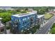 Modern blue and brown apartment building featuring exterior balconies and street views at 515 N Mangum St # 41, Durham, NC 27701