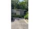Modern exterior of home featuring a minimalist design, greenery and a concrete block privacy wall at 515 N Mangum St # 41, Durham, NC 27701