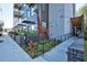 Street view of condo building with gray siding and a metal giraffe art display on the sidewalk at 515 N Mangum St # 41, Durham, NC 27701