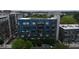 Attractive, modern multi-Gathering building featuring a blue facade with well-placed windows and manicured landscaping at 515 N Mangum St # 41, Durham, NC 27701