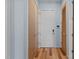 Entryway hallway featuring hardwood floors and wood paneled doors at 515 N Mangum St # 41, Durham, NC 27701