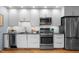 Modern kitchen with white cabinets, stainless steel appliances, and a sleek countertop at 515 N Mangum St # 41, Durham, NC 27701
