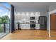 Modern kitchen featuring stainless steel appliances and sliding glass doors to a balcony at 515 N Mangum St # 41, Durham, NC 27701