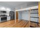 Open living area with modern kitchen appliances and a unique loft bed design with a ladder at 515 N Mangum St # 41, Durham, NC 27701
