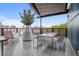 Outdoor terrace with a dining set, chairs, and a plant, perfect for relaxing or entertaining guests at 515 N Mangum St # 41, Durham, NC 27701