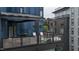A cozy outdoor patio with modern railings, seating, and grilling area, perfect for relaxing and entertaining at 515 N Mangum St # 41, Durham, NC 27701
