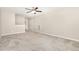Spacious bedroom with plush carpeting, neutral walls, and access to an ensuite area with dual closets and storage at 57 S Shreve Dr, Wendell, NC 27591